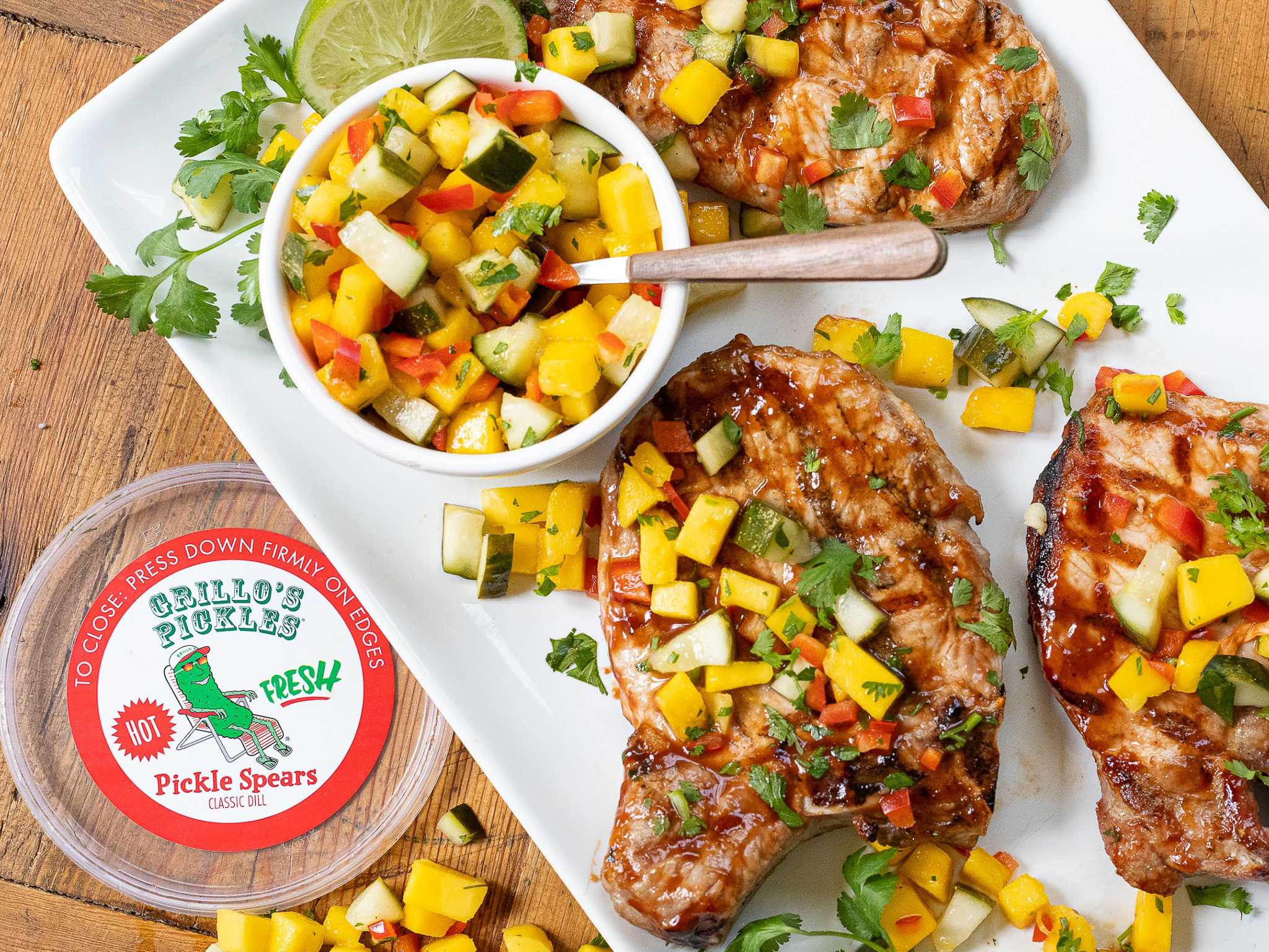 Grab Some Grillo’s Pickles & Serve Up My Grilled BBQ Pork Chops With Hot Pickle & Mango Relish At Your Memorial Day Gathering